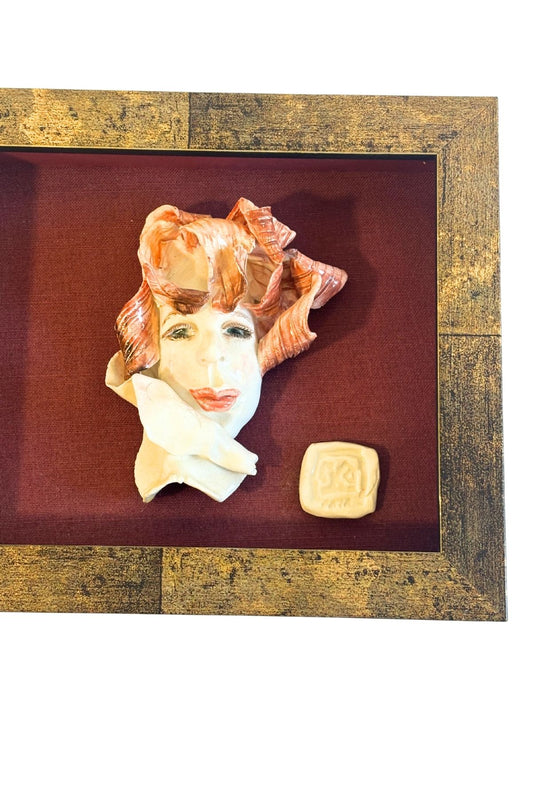 Funky framed clay portrait