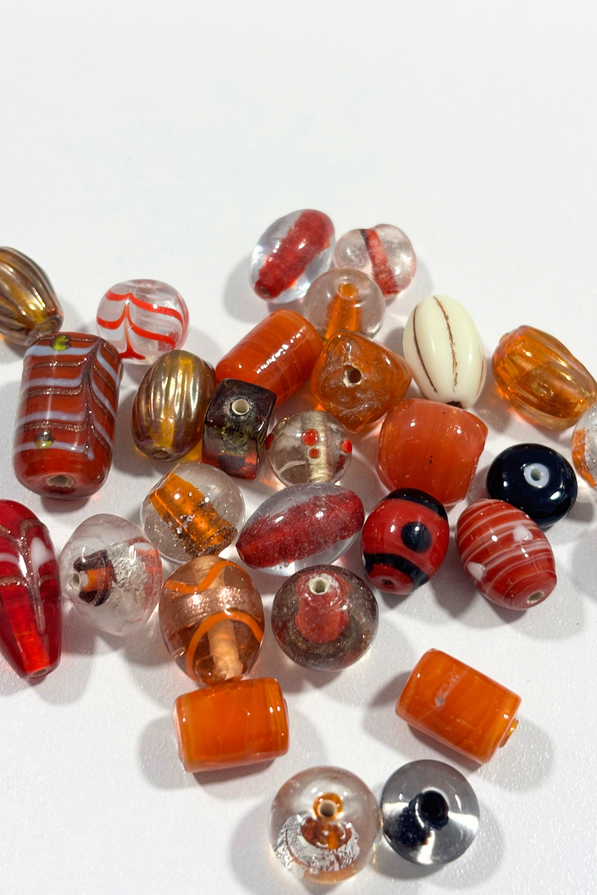 Beautiful, assorted orange glass beads