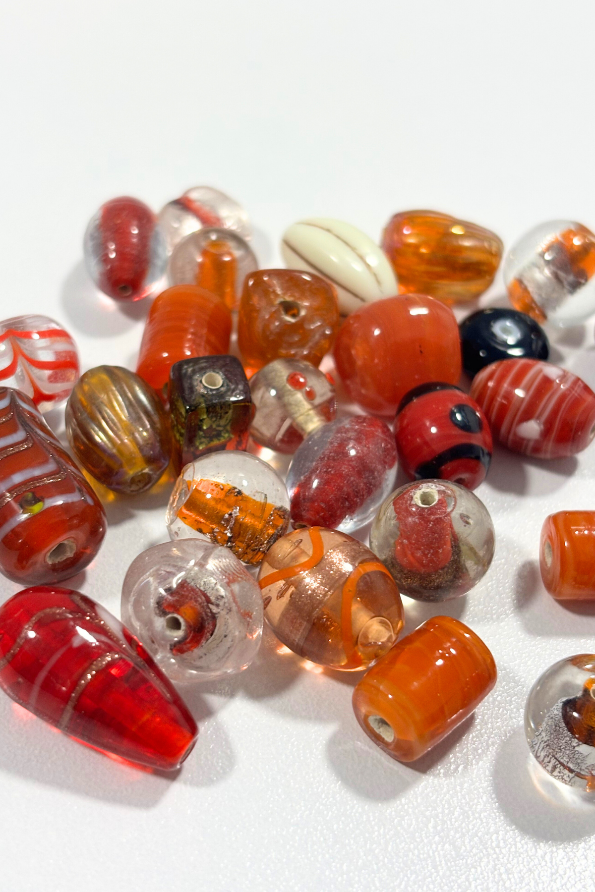 Beautiful, assorted orange glass beads