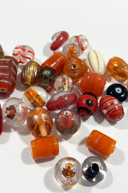 Beautiful, assorted orange glass beads