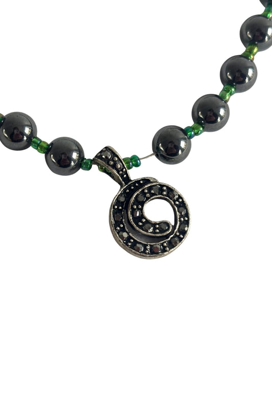 Beaded diamante koru necklace