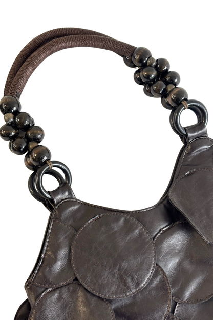 Circle patches beaded handle bag