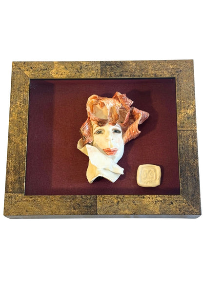 Funky framed clay portrait