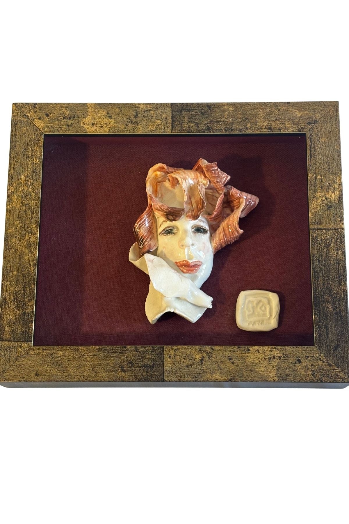 Funky framed clay portrait