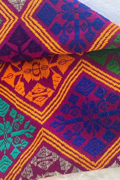 Vibrant colourful embroidered fabric