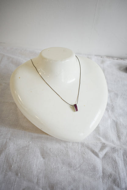 Pink sparkly pendant on silver chain